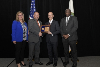 Soni Blanco, Senior Technical Program Manager for Planning and Coordination, SRS; Charles Comeau, Deputy Federal Project Director, SDU Project; DOE Under Secretary of Energy Mark Menezes; and Thomas Johnson, Associate Deputy Manager, SRO Office.