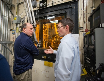 DOE Facility Representative for the Defense Waste Processing Facility Keith Sandroni (right) provides an overview of DWPF melter operations to Under Secretary for Science Paul Dabbar.