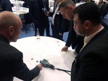 Participants practice identifying radioactive source material using a Radioisotope Identifier.