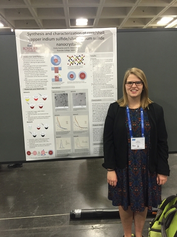 Emily Searles presents a poster of her research conducted as a Savannah River National Laboratory intern at the laboratoryâs poster presentation.