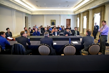 Panel participants engage students from various universities.