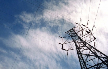 Close-up of an electrical transmission tower.