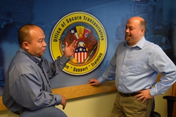 Anh Nguyen, left, talks to OST Deputy Assistant Deputy Administrator Kerry Clark.