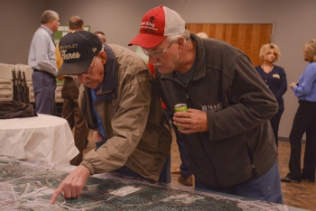 Area residents examine a tabletop model of the Portsmouth Site at one of the recent community open houses conducted by EM and stakeholder organizations.