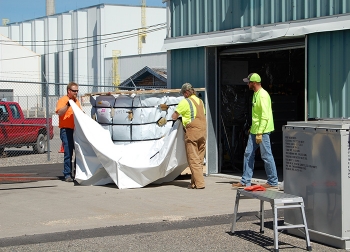 During the macro encapsulation process, waste boxes are wrapped in three layers of tightly cinched special plastic to create an impermeable seal between the waste and the disposal environment.