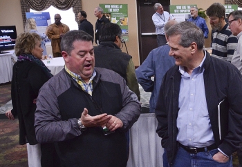EMâs Greg Simonton (left) talks with Lee Blackburn of the Sierra Club during one of the community open houses in southern Ohio last week.