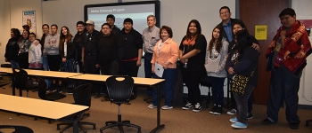 Fluor Idaho President Fred Hughes and Communications Director Ann Riedesel (center) gather with the students from Fort Hall Junior and Senior High School after the career opportunity class organized by the Foundation for Indigenous Education, Leadership D