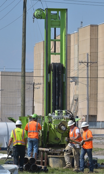 Drill rig operators prepare to retrieve a sample to be used to determine the location of the wells to optimize pump-and-treat operations at the Paducah Siteâs northeast plume.
