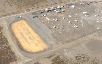 Workers recently finished the SX Farm evapotranspiration basin, shown in light brown. It will collect and evaporate water drained from new interim surface barriers to be installed later this spring over Hanfordâs SX Tank Farm, shown at the right.