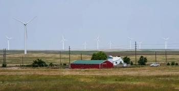 Farm with a wind turbine.