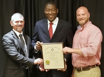 Swift & Staley Team (SST) award presentation, left to right: SST Environment, Safety and Health Manager John Hobbs; Kentucky Labor Secretary Derrick Ramsey; and SST United Steel Workers Safety Representative Jason Gilbert.