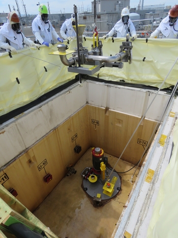 One of two jumpers is placed inside pump pit AZ-02A.