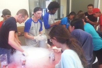 High school students learn about the properties of liquid nitrogen at Energy Day