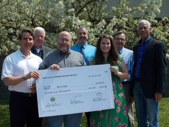 Donation to Mercy Flight, back row, left to right: Jeff Bradford, CHBWV president and general manager; Bryan Bower, EM WVDP site director; Paul Bembia, NYSERDA director; and Scott Anderson, CHBWV deputy general manager; front row, left to right: Dan Sulli