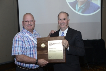 Matt Moury, DOE Associate Under Secretary for Environment, Health, Safety and Security, right, presents the Facility Representative of the Year Award to Tom Kohler of the Savannah River Site.