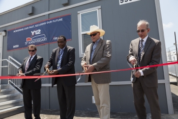 Officials cut the ribbon to open a new building and nuclear security mission for Y-12 National Security Complex: the NBL Center.