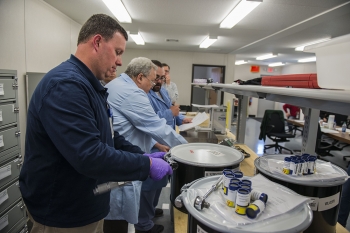 Workers prepare a shipment in Y-12 National Security Complexâs new NBL Center. The center provides special nuclear certified reference samples internationally.