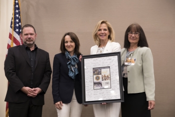 Consortia program directors present NNSA Administrator Ms. Lisa E. Gordon-Hagerty with a plaque signed by students for NNSAâs support of university research and education programs in nuclear security and nonproliferation.