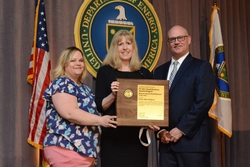 Amy Blasdel, Pacific Office Solutions employee; Julie Valdez, the company's owner; and Charlie Smith, Director of DOE's Office of Small and Disadvantaged Business Utilization