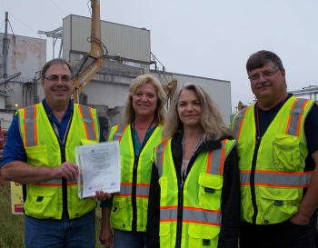 CH2M HILL BWXT West Valley Regulatory Strategy team members, Jerry Hoch, Janice Williams, Kim Mansfield, and David Klenk show the siteâs environmental management system program certificate issued by the International Organization for Standardization.