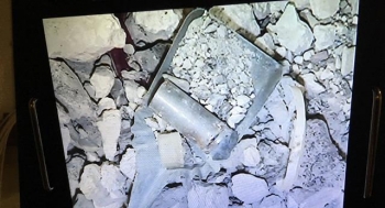 A view of radioactively contaminated concrete debris found inside one of 27 containers being processed at the former spent nuclear fuel hot cells at the Idaho Nuclear Technology and Engineering Center.