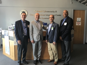 Photo of Under Secretary Mark Menezes, Assistant Secretary Bruce J. Walker, and two other particpants