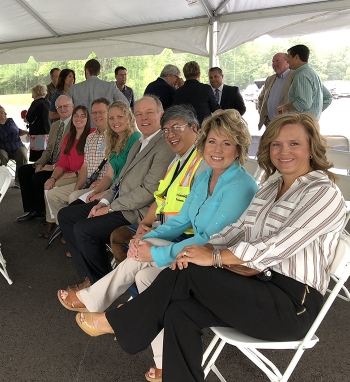 Fluor-BWXT Portsmouthâs land transfer team attends the Parcel 1 ceremony. Pictured, front to back, Christy Veach, Jill Thomson, J.D. Chiou, Bob Smith, Ashley Jordan, Bruce Phillips, Elizabeth Grubb, and Ken Dewey.