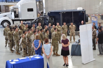 Kirtland Air Force Base security officers attended an open house at the OST aviation hangar to get briefings on its mission and get a close-up look at specialized vehicles and aircraft used to transport materials and personnel.