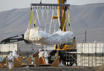To reduce the amount of contaminated material at the Plutonium Finishing Plant by 90 percent (by plutonium content) before demolition resumes.