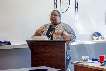 The Oak Ridge Office of Environmental Managementâs Vanna Gaffney speaks about radiation protection at Oak Ridge City Schoolsâ Back to School Professional Development Day.
