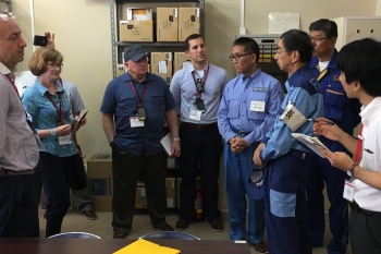 Japanese Minister of the Environment Tadahiko Ito greeting the observer group at a temporary evacuation center during the exercise.