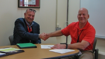 EM Los Alamos Field Office Manager Doug Hintze, right, and Newport News Nuclear BWXT-Los Alamos, LLC President and Program Manager Nick Lombardo.