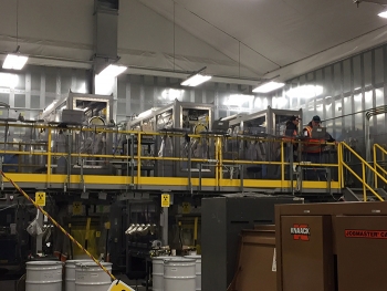 Waste from the Accelerated Retrieval Project VIII is processed in these drum packaging stations.