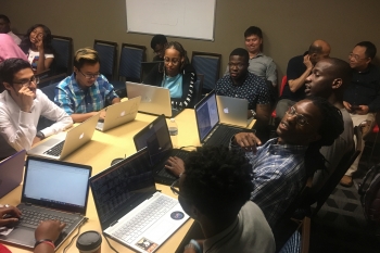 Students from Prairie View A&M University and Tennessee State University discuss the group project.