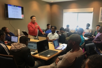Dr. Lizhi Ouyang, a physics professor from Tennessee State University gives a lecture to the computational workshop participants.
