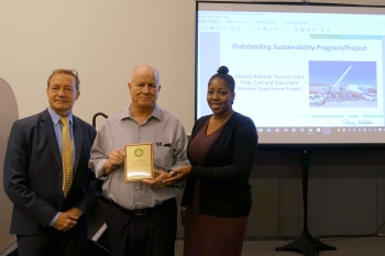 Kevin Carroll, DOE Sustainability Performance Office (left), presented Doug Trone and Patrice Claxton of Nevada National Security Site with the Outstanding Sustainability Program/ Project Award for âFleet, Fuel and Equipment Services Departmentâ.