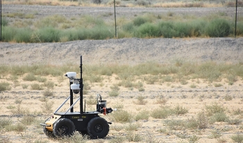 A rover crosses the terrain near Hanfordâs SX Tank Farm during a recent field demonstration.
