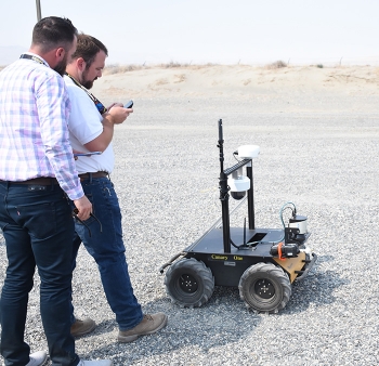 Washington River Protection Solutions staffers prepare the rover for its next demonstration.