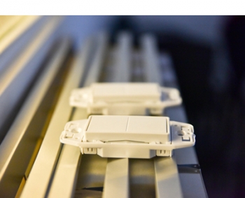 Photo of two wall control components.