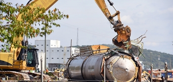 Made of stainless steel, the 74-foot silo will be shipped for recycling.