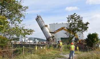 Crews began demolishing Building K-1232 by knocking down a 74-foot silo that was part of the structure.