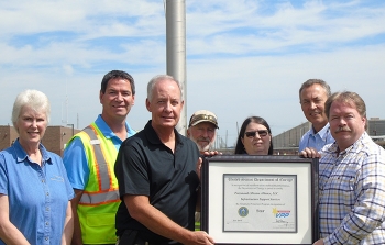 Portsmouth Mission Alliance United Steelworkers (USW) presents the latest Voluntary Protection Program (VPP) certificate at the Portsmouth Site flagpole where the VPP STAR flag flies for the eighth consecutive year.
