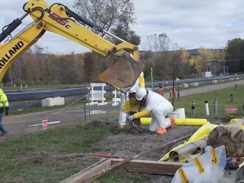 Workers prepare to remove a well pump from a former pump-and-treat system at EMâs West Valley Demonstration Project site.