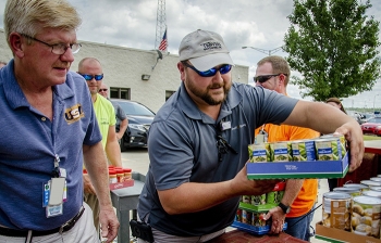 Loading donated food items onto trucks at the Paducah Site.