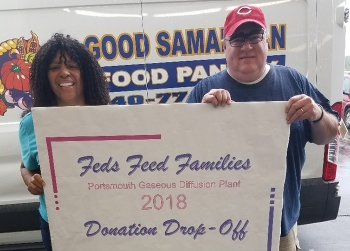 Dewintus Powell, left, of the Portsmouth/Paducah Project Office, with Rob Downard of the Ross County Ohio Good Samaritan Network Food Pantry at a donation drop-off.