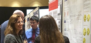 Dr. Kathleen Alexander and a University of Notre Dame student discuss research at the 2018 Stewardship Science Academic Programs Symposium poster session.