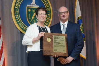 Teresa Martinez accepts her Federal Procurement Director of the Year award