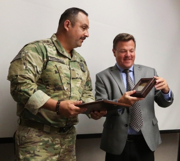 Livermore Field Office Manager Peter Rodrik delivers Rodriguez a citation from NNSA Administrator Lisa Gordon-Hagerty for his quick thinking during an incident in May.