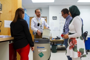 Participants learn how to use the Active Well Coincidence Counter, an IAEA inspection tool, to measure uranium at Los Alamos National Laboratory in July.