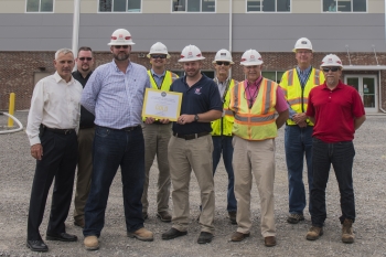 Y-12 National Security Campusâs âBuilding Partnerships for a Sustainable Futureâ Strategic Partnerships for Sustainability Award winners (from left) Gene Sievers, Tim Hutson, Nathan Wallace, Bud Slaven, Jason Phillips, Don Peters, Joe Duncan, Halen Phi